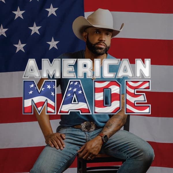 Coffey Anderson in cowboy hat in front of American flag.