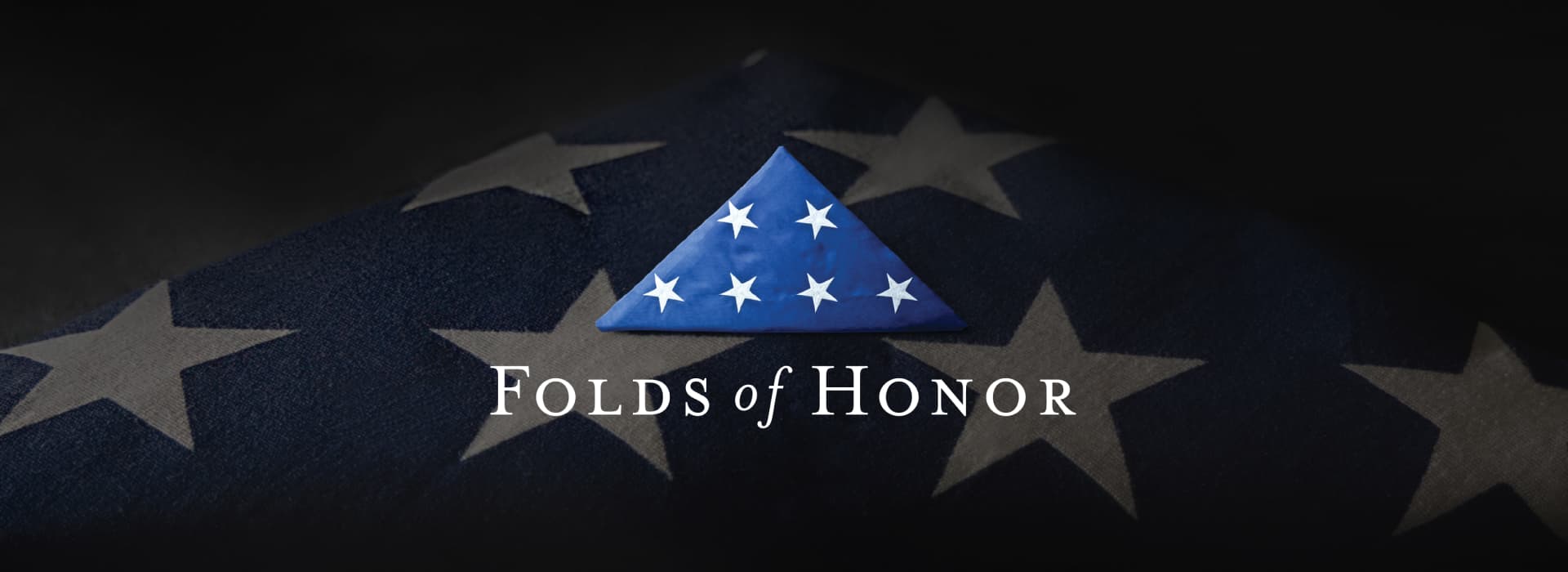 Folded American flag with stars.
