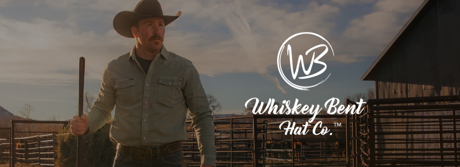 Man wearing cowboy hat wearing Whiskey Bent belt buckle. 