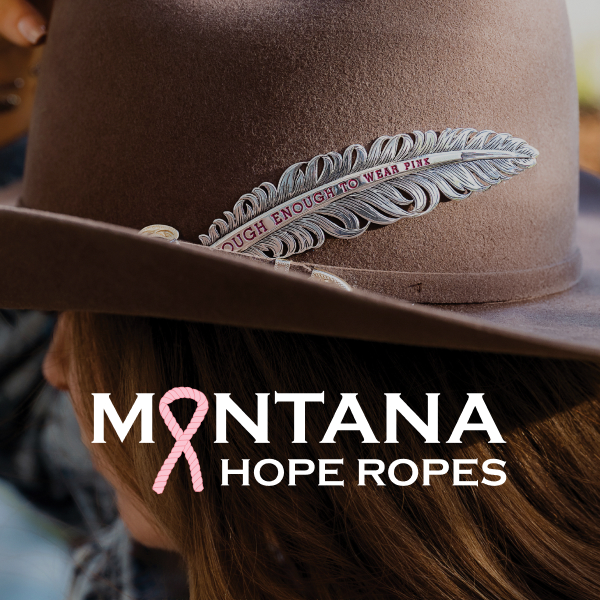 Women wearing cowboy hat with Tough Enough To Wear Pink hat feather.