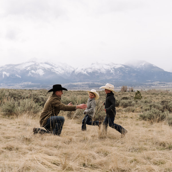 Dad with sons in Montana mountain scene