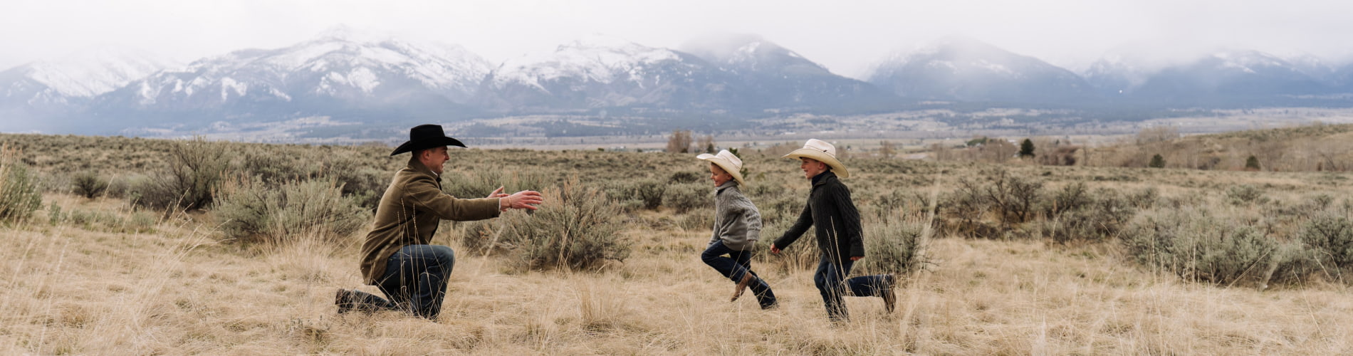 Dad with sons in Montana mountain scene