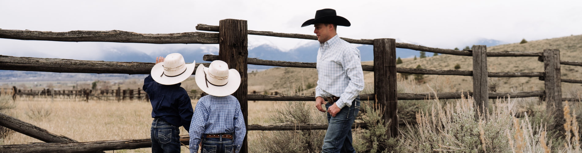 Dad with kids in Montana mountain scene