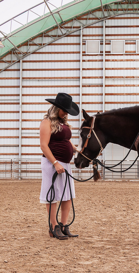 Mom and horse Standing in Barn