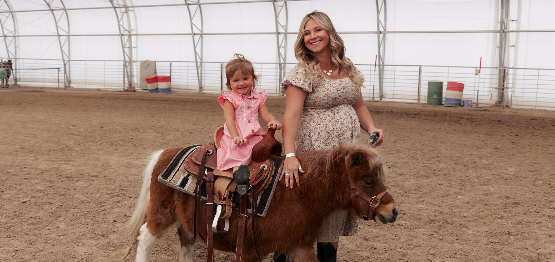 Mom and Daughter Riding Pony