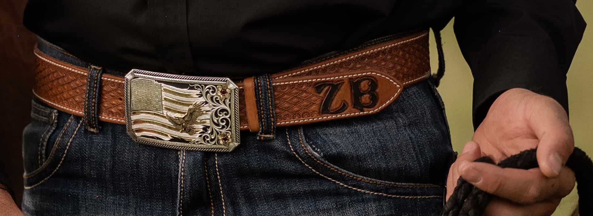 Man wearing buckle with American flag and eagle