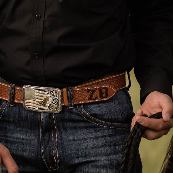 Man wearing buckle with American flag and eagle